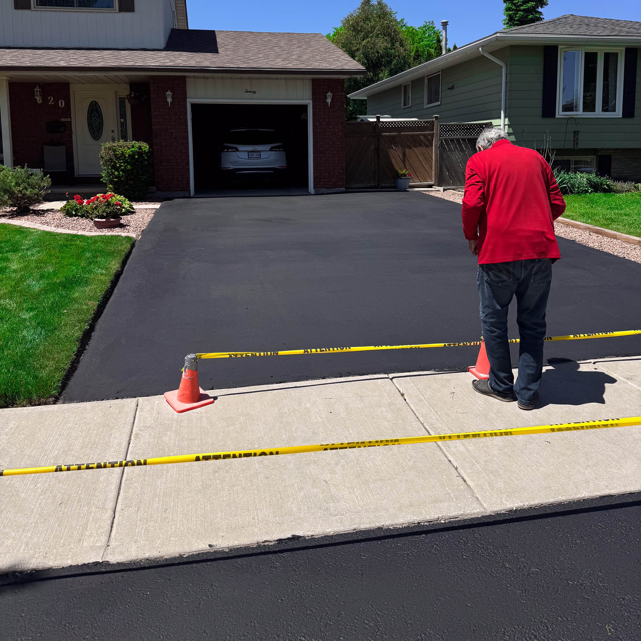 Freshly sealed asphalt driveway in Hamilton by Grand River Blacktop