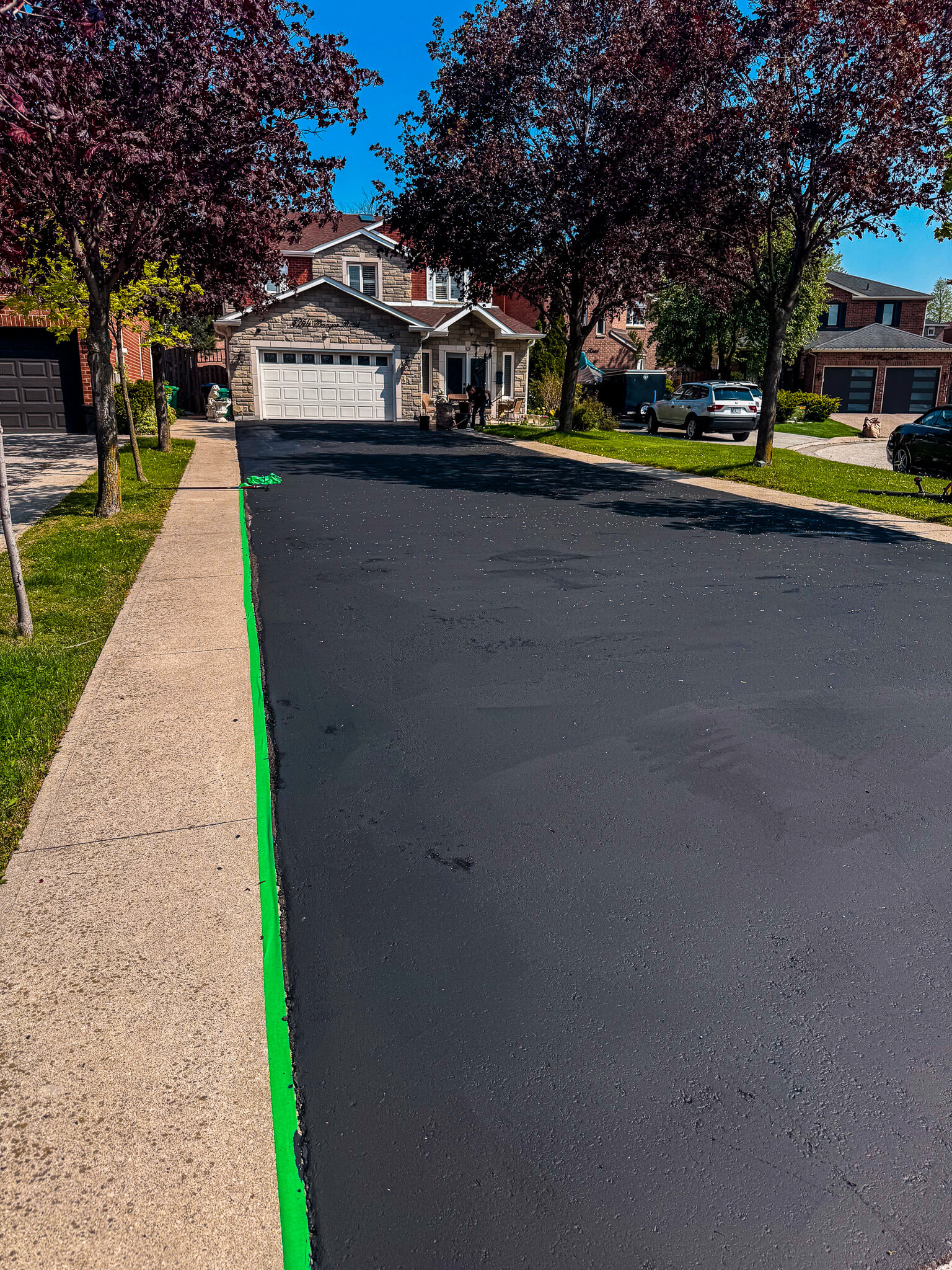 Finished asphalt driveway sealing result